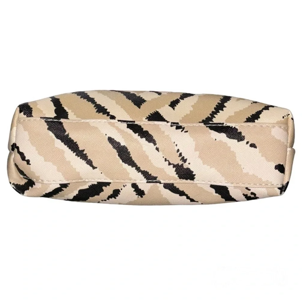 Ruby Cash animal print top zipper makeup bag. Black, tan and cream.